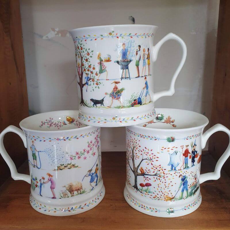 A set of three Jane Abbott fine bona china mugs in the seasons range