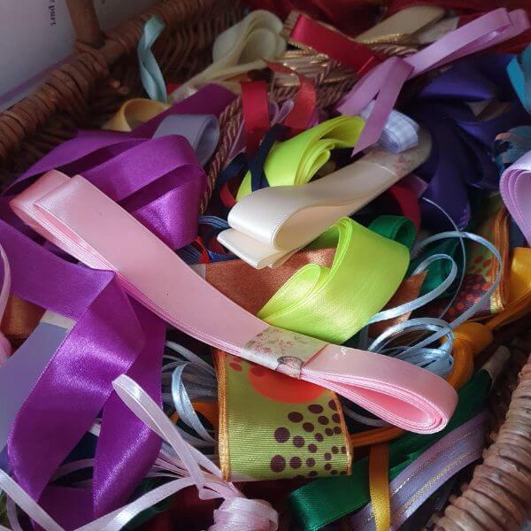 A selection of different ribbons, in pinks, yellows and purples